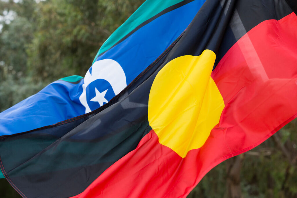 Aboriginal and Torres Strait Flags flowing in wind.