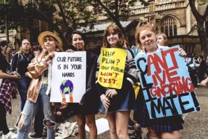 climate-change-activists-holding-signs-at-rally